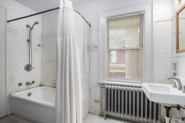 706 Park Ave, South Bend, IN 46616 - full bath featuring radiator, shower / bath combo, tile walls, and tile patterned floors