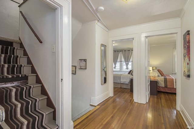 706 Park Ave, South Bend, IN 46616 - hallway with hardwood / wood-style flooring, stairway, baseboards, and ornamental molding