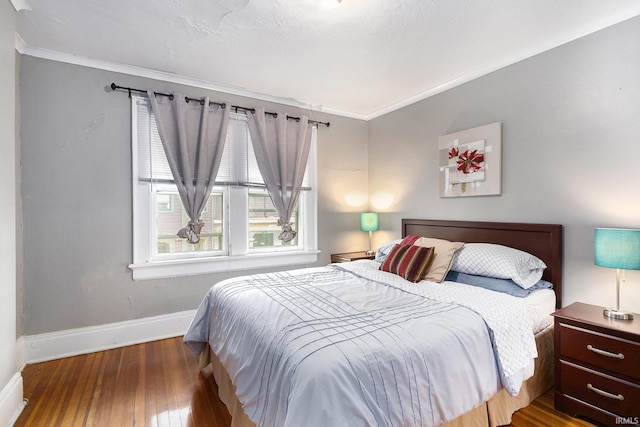 706 Park Ave, South Bend, IN 46616 - bedroom featuring ornamental molding, hardwood / wood-style floors, and baseboards