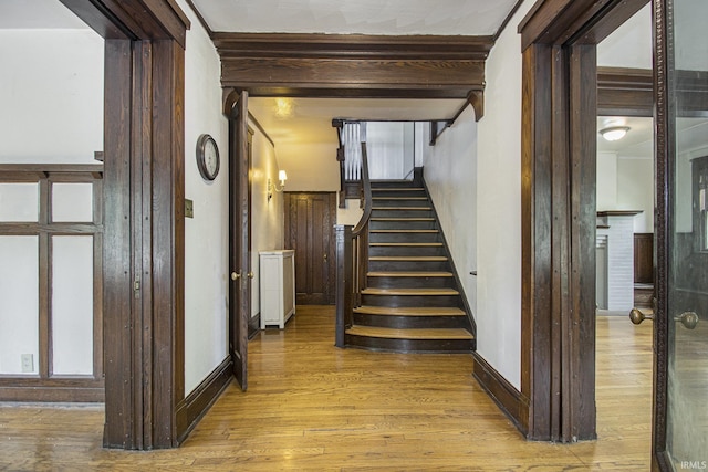 706 Park Ave, South Bend, IN 46616 - staircase with wood finished floors, baseboards, and beamed ceiling