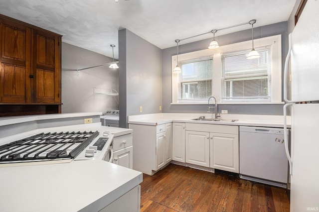 706 Park Ave, South Bend, IN 46616 - kitchen with white appliances, a sink, light countertops, dark wood-type flooring, and white cabinetry