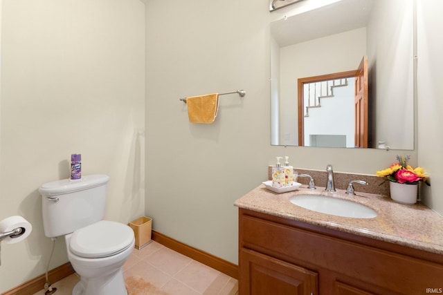 1095 E 600 N, Columbia City, IN 46725 - half bath with toilet, baseboards, vanity, and tile patterned floors