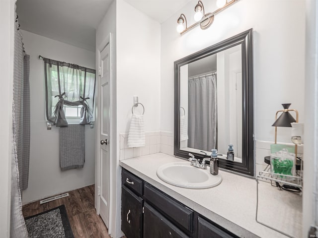 11219 Denzer Rd, Evansville, IN 47712 - full bathroom with wood finished floors and vanity