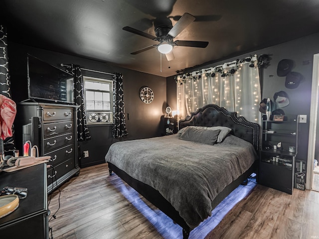 11219 Denzer Rd, Evansville, IN 47712 - bedroom featuring wood finished floors and a ceiling fan
