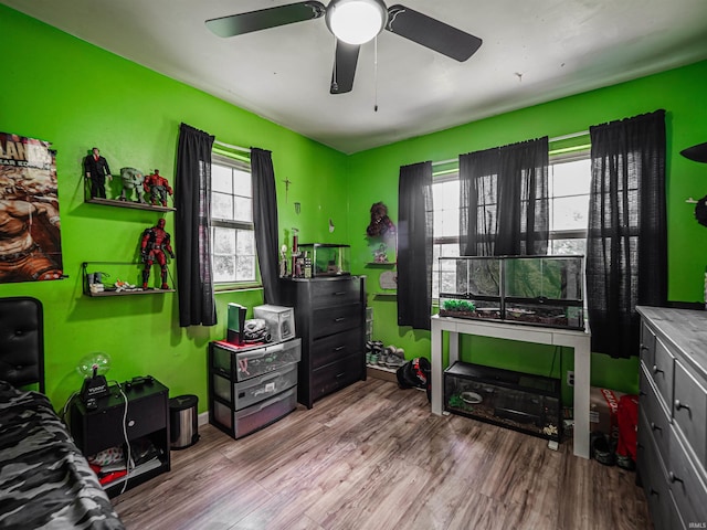 11219 Denzer Rd, Evansville, IN 47712 - bedroom with wood finished floors and a ceiling fan