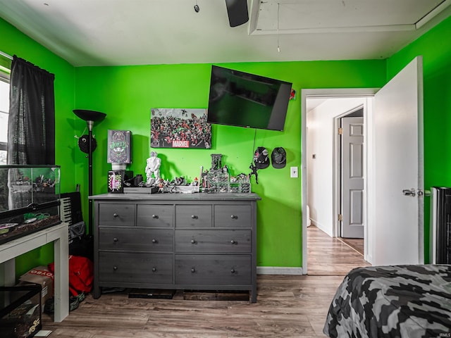11219 Denzer Rd, Evansville, IN 47712 - bedroom with attic access, wood finished floors, and baseboards