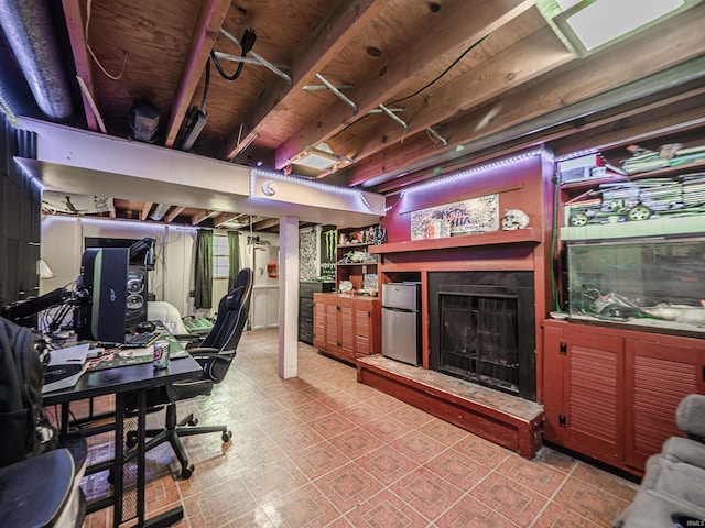 11219 Denzer Rd, Evansville, IN 47712 - below grade area featuring freestanding refrigerator, a fireplace with raised hearth, and an office area