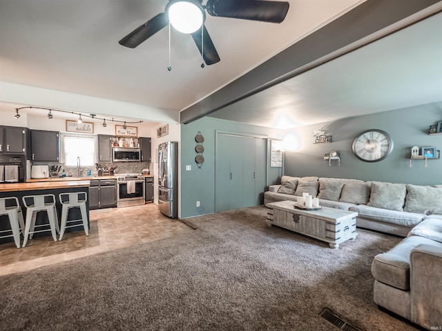 11219 Denzer Rd, Evansville, IN 47712 - living area with light colored carpet, track lighting, and ceiling fan