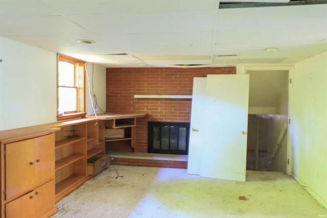 802 Hasenour Ave, Jasper, IN 47546 - unfurnished living room with a brick fireplace