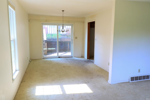 802 Hasenour Ave, Jasper, IN 47546 - unfurnished room featuring carpet, healthy amount of natural light, and a chandelier