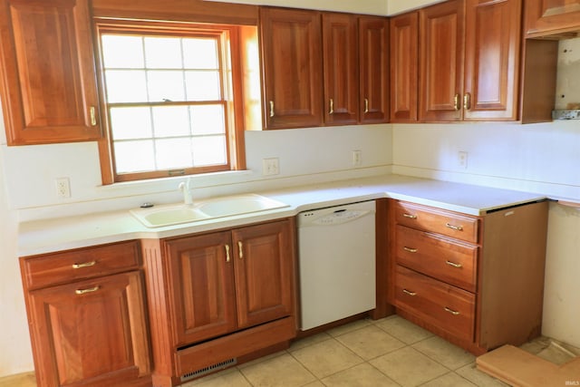 802 Hasenour Ave, Jasper, IN 47546 - kitchen featuring white dishwasher, a sink, light countertops, and brown cabinets