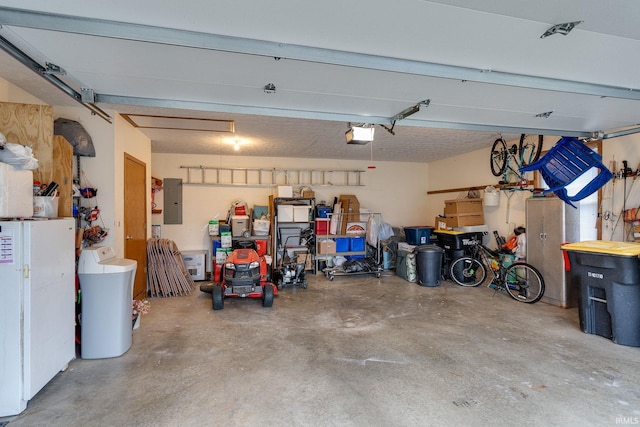 300 S Heritage Dr, Delphi, IN 46923 - garage featuring electric panel and a garage door opener