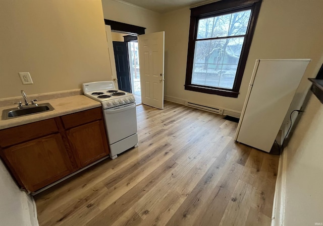 2130 Broadway, Fort Wayne, IN 46802 - kitchen featuring white range with electric stovetop, a sink, brown cabinetry, light wood finished floors, and a baseboard radiator