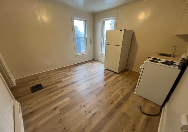 2130 Broadway, Fort Wayne, IN 46802 - kitchen with white appliances, light wood finished floors, and a sink
