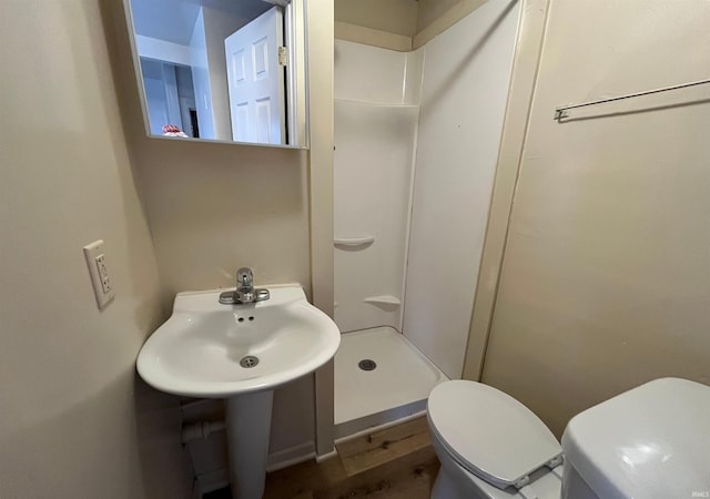 2130 Broadway, Fort Wayne, IN 46802 - bathroom featuring toilet, a shower stall, and a sink