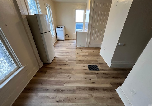 2130 Broadway, Fort Wayne, IN 46802 - hall with healthy amount of natural light, light wood-style flooring, and baseboards