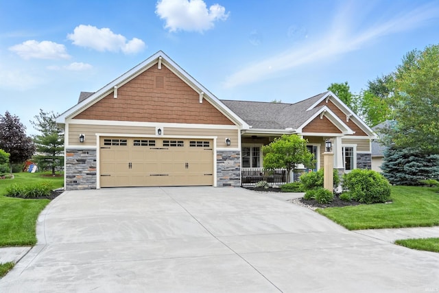 12815 Chaplin Ct, Fort Wayne, IN 46845 - craftsman-style home featuring concrete driveway, an attached garage, stone siding, a front lawn, and covered porch