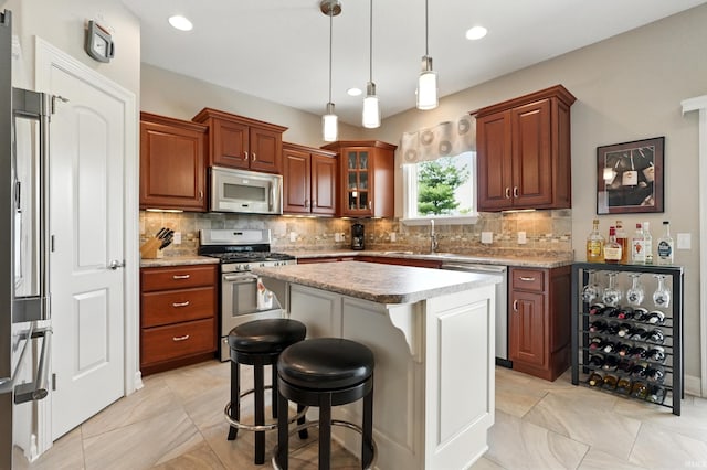 12815 Chaplin Ct, Fort Wayne, IN 46845 - kitchen featuring stainless steel appliances, a sink, decorative backsplash, pendant lighting, and recessed lighting
