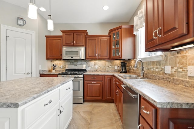 12815 Chaplin Ct, Fort Wayne, IN 46845 - kitchen with appliances with stainless steel finishes, a sink, glass insert cabinets, tasteful backsplash, and recessed lighting