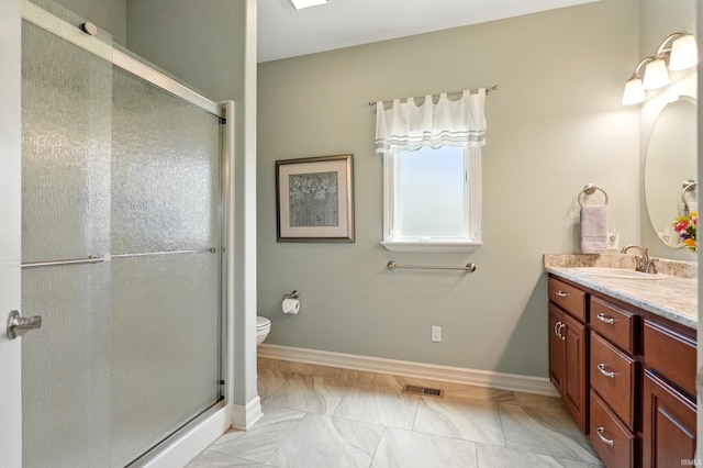 12815 Chaplin Ct, Fort Wayne, IN 46845 - full bath with vanity, a shower stall, toilet, and baseboards