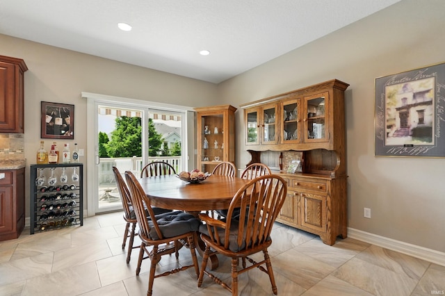 12815 Chaplin Ct, Fort Wayne, IN 46845 - dining room featuring beverage cooler, recessed lighting, and baseboards