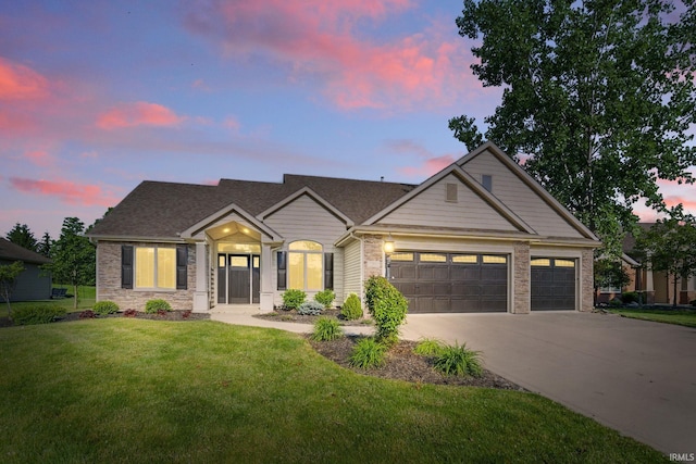 12911 Jade Cv, Fort Wayne, IN 46845 - traditional-style home with an attached garage, a lawn, and concrete driveway