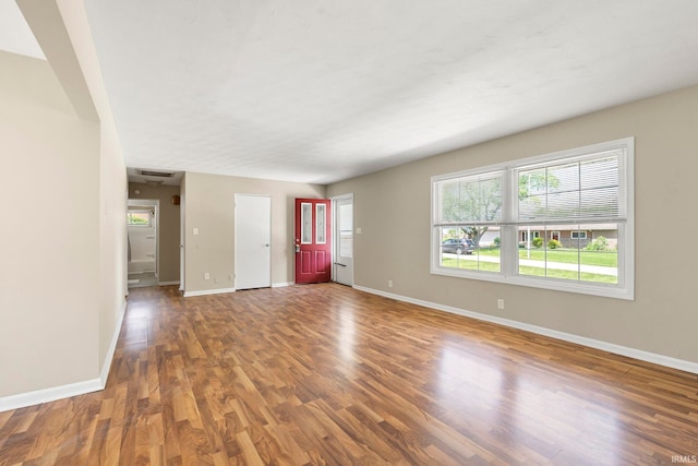 2604 Bellevue Dr, Fort Wayne, IN 46825 - unfurnished living room featuring wood finished floors and baseboards