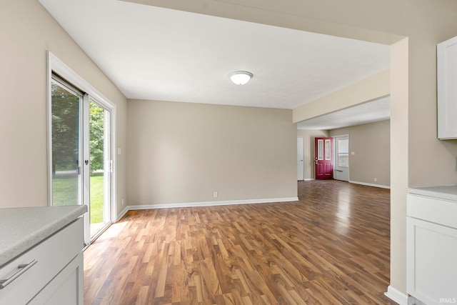 2604 Bellevue Dr, Fort Wayne, IN 46825 - unfurnished living room featuring light wood-style floors and baseboards