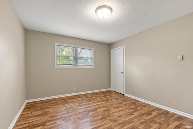 2604 Bellevue Dr, Fort Wayne, IN 46825 - spare room featuring wood finished floors and baseboards