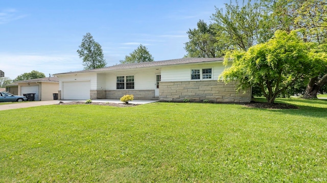 2604 Bellevue Dr, Fort Wayne, IN 46825 - ranch-style house with an attached garage, a front yard, stone siding, and driveway