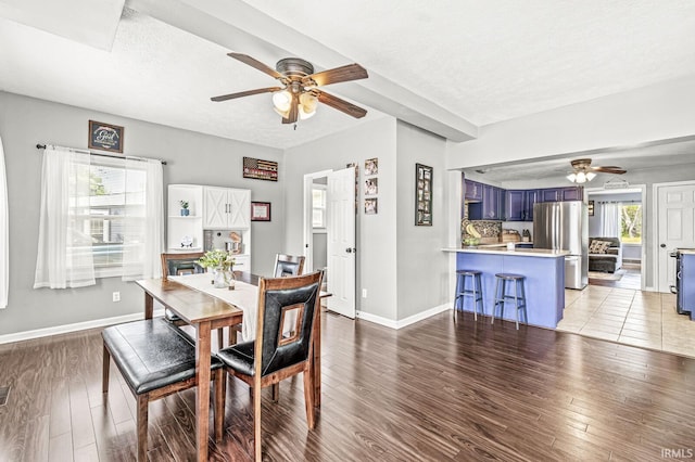 542 E Michigan St, New Carlisle, IN 46552 - dining room with a ceiling fan, light wood finished floors, a textured ceiling, and baseboards