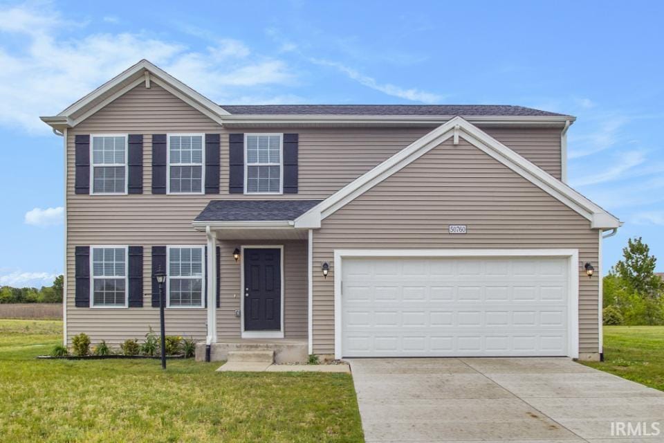 50760 Deer Crossing Trl, Elkhart, IN 46514 - traditional-style house featuring a front lawn and driveway
