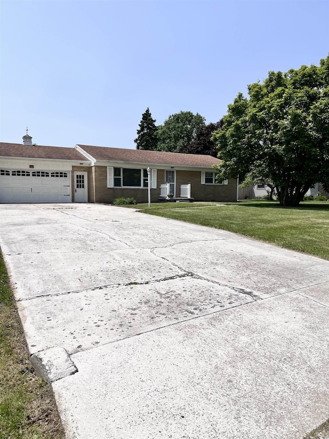 503 Laura Ln, Sweetser, IN 46987 - single story home featuring driveway, an attached garage, and a front lawn