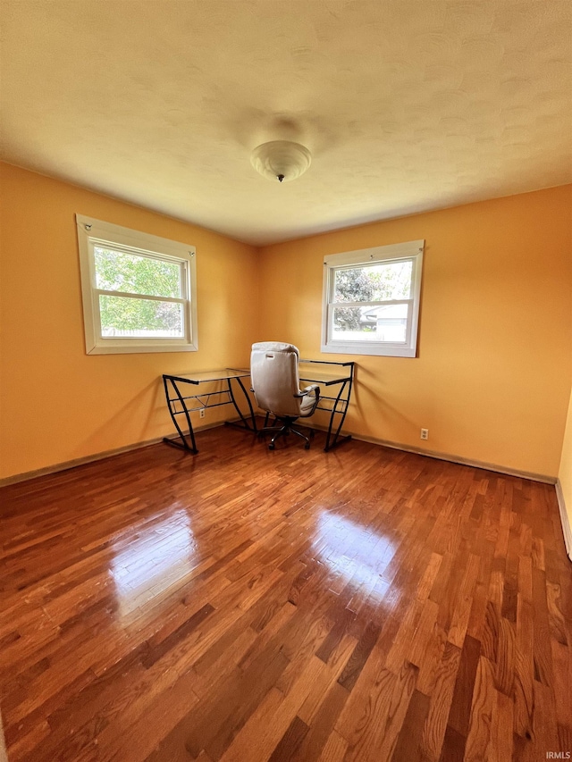 503 Laura Ln, Sweetser, IN 46987 - sitting room with plenty of natural light, wood finished floors, and baseboards