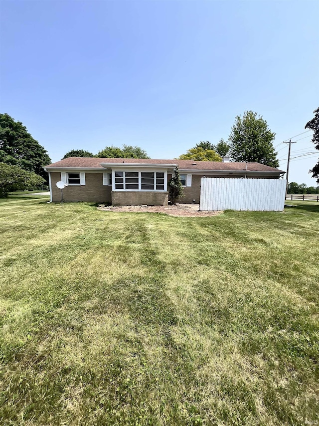 503 Laura Ln, Sweetser, IN 46987 - rear view of property with a yard and brick siding