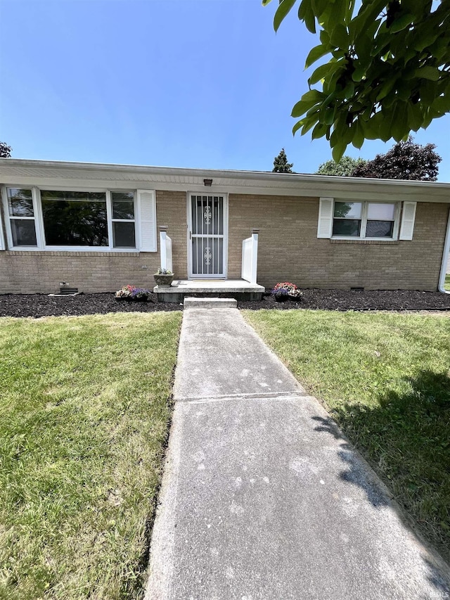 503 Laura Ln, Sweetser, IN 46987 - ranch-style house featuring brick siding, a front lawn, and crawl space