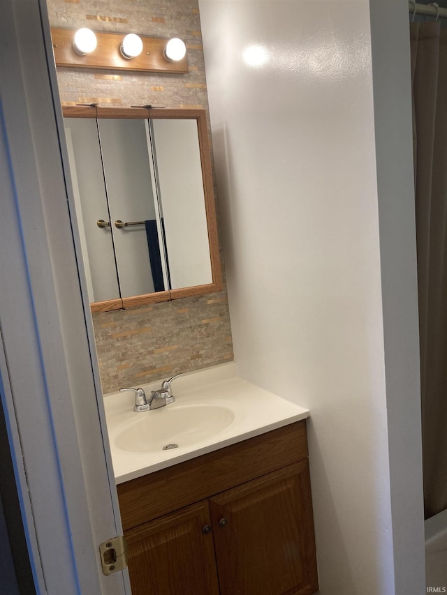 449 Cline St, Huntington, IN 46750 - bathroom featuring vanity and backsplash