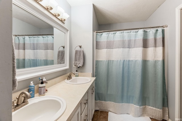 210 Meadows Dr, Greentown, IN 46936 - bathroom with double vanity, tile patterned flooring, a textured ceiling, and curtained shower