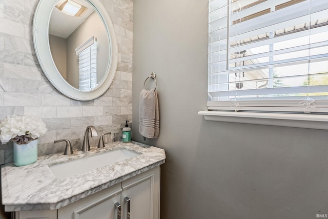 210 Meadows Dr, Greentown, IN 46936 - bathroom featuring plenty of natural light, vanity, and backsplash
