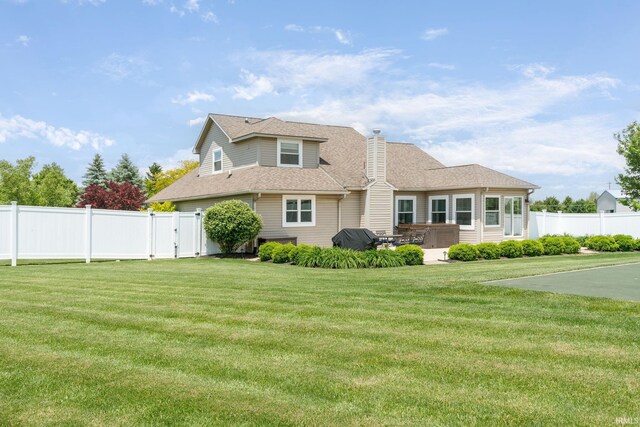 210 Meadows Dr, Greentown, IN 46936 - view of front of house featuring a chimney, a shingled roof, and a gate