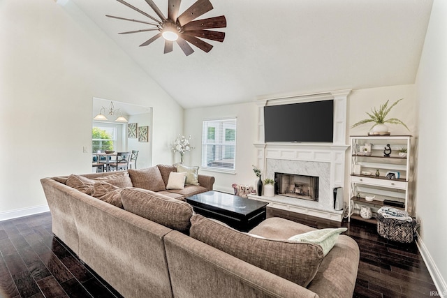 210 Meadows Dr, Greentown, IN 46936 - living room featuring a ceiling fan, dark wood-style floors, baseboards, a high end fireplace, and high vaulted ceiling