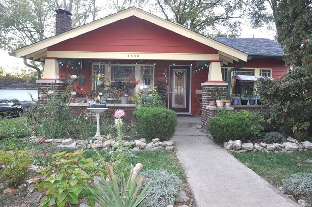 1502 S College Ave, Bloomington, IN 47403 - view of front of property with a porch and a chimney
