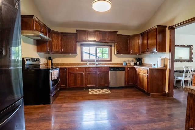 1339 Clark Ave, Bluffton, IN 46714 - kitchen featuring appliances with stainless steel finishes, wall chimney range hood, a sink, vaulted ceiling, and dark wood finished floors