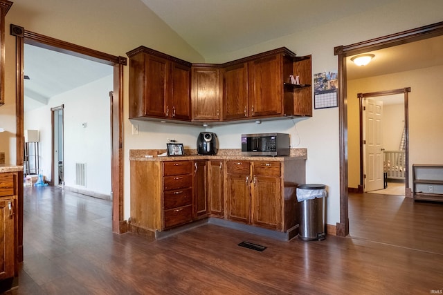 1339 Clark Ave, Bluffton, IN 46714 - kitchen featuring stainless steel microwave, vaulted ceiling, dark wood-style floors, baseboards, and open shelves