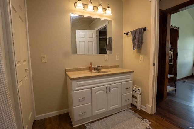1339 Clark Ave, Bluffton, IN 46714 - bathroom with wood finished floors, vanity, and baseboards