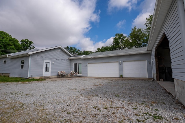 1339 Clark Ave, Bluffton, IN 46714 - view of front facade with a garage and driveway