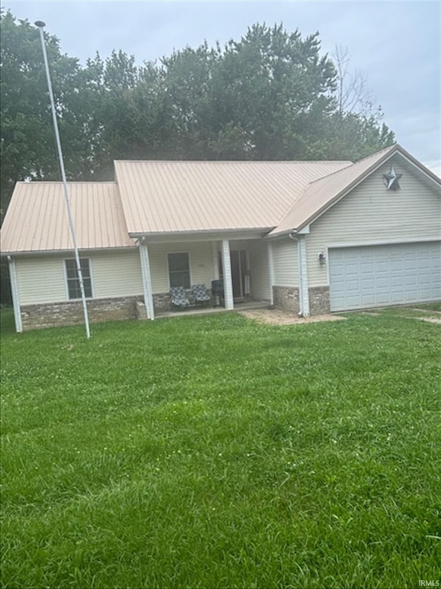 999 Inderrieden Rd, Chandler, IN 47610 - ranch-style home with a front yard, a garage, and metal roof