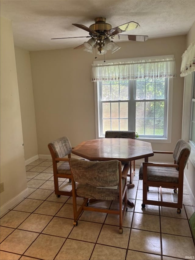 999 Inderrieden Rd, Chandler, IN 47610 - dining area with light tile patterned floors, ceiling fan, baseboards, and a textured ceiling