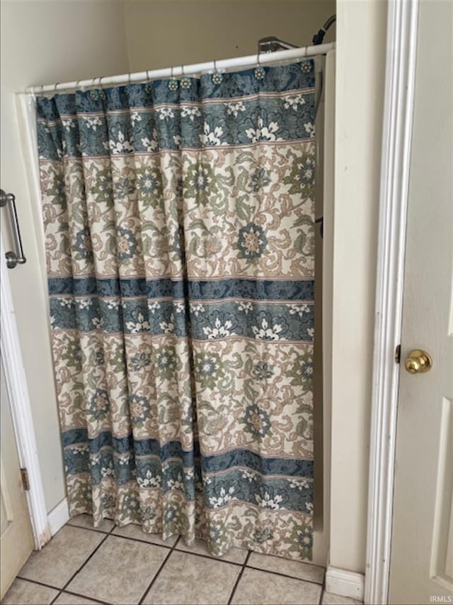 999 Inderrieden Rd, Chandler, IN 47610 - full bath with tile patterned flooring and a shower with shower curtain