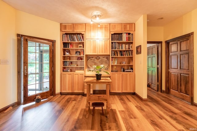 5003 N Chatham Dr, Bloomington, IN 47404 - office featuring light wood-style flooring, baseboards, and a textured ceiling